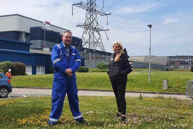 Ian Pilton, plant manager at Heysham 1 power station with Sacha Dench who is attempting to be the first to circumnavigate the mainland of Britain using an electric paramotor.