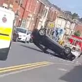 A man was taken to hospital after a car flipped onto its roof in Preston. (Credit: Izy Ahmed)