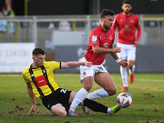 Josh McPake playing for Harrogate Town against Morecambe last season
