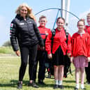 Sacha Dench the Human Swan with year five pupils from Rylands Primary School and the paramotor (l-r) Leon Lowther, Lillie Rose Watt, Destiny Louis,
Jacob Pinder. Photo: Kelvin Stuttard