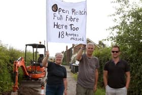 Photo Neil Cross; Barbara and Richard Farbon with Gavin Hughes protesting against Open Reach in Bretherton