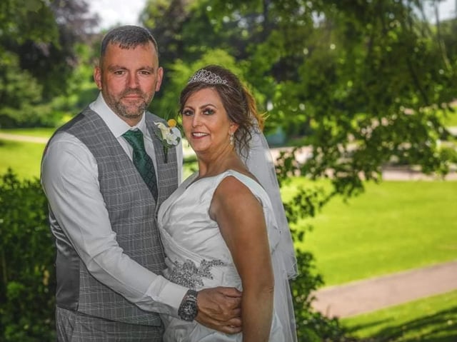 Tracy and David tied the knot after rescheduling their wedding twice. Photo by Paul King photography
