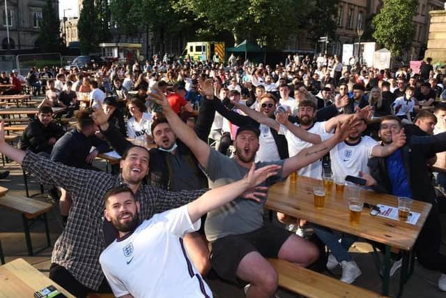 Fans at the England v Czech Republic match on Preston's Flag Market.
