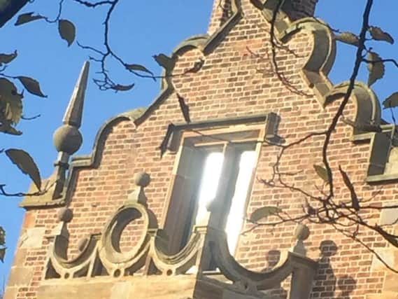 A glint of light  on a window at Bank Hall in Bretherton