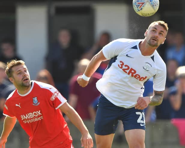 Preston defender Patrick Bauer heads the ball clear with Bamber Bridge's Alistair Waddecar in close attendance during the time the two clubs met
