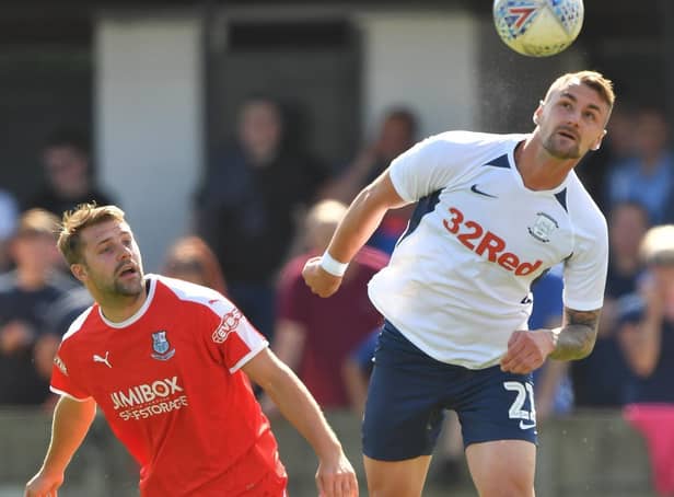 Preston defender Patrick Bauer heads the ball clear with Bamber Bridge's Alistair Waddecar in close attendance during the time the two clubs met