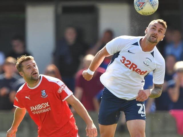 Preston defender Patrick Bauer heads the ball clear with Bamber Bridge's Alistair Waddecar in close attendance during the time the two clubs met