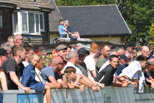 Supporters watch Bamber Bridge's friendly with Preston North End in July 2019