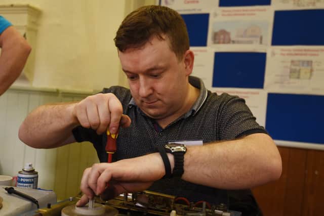 Steve Stott repairing electricals at the Chorley Repair Cafe, held at Chorley United Reformed Church hall, in 2020