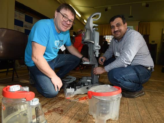 Volunteers Paul Blackett and Abdulla Ismil at the Chorley Repair Cafe, pictured in 2020