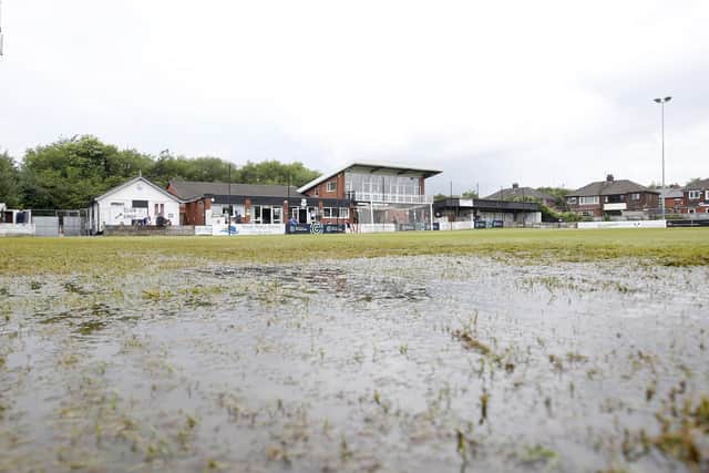 The waterlogged pitch at the Sir Tom Finney Stadium