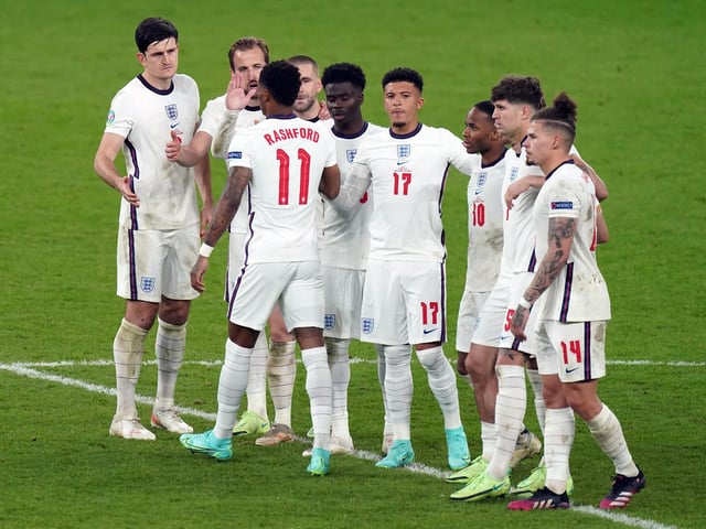 England's Marcus Rashford stands dejected with team mates after missing from the penalty spot during the penalty shoot out following the UEFA Euro 2020 Final at Wembley Stadium, London.