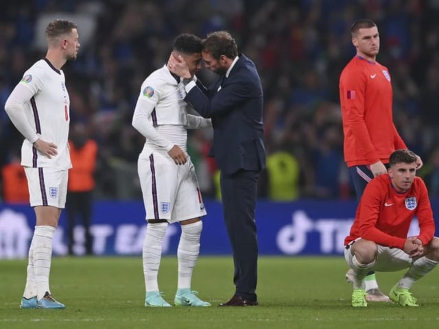 Jadon Sancho is comforted by manager Gareth Southgate after the penalty shoot-out nightmare at Wembley.