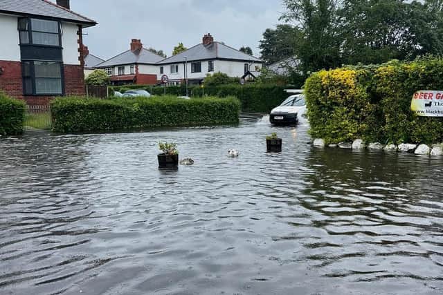 The downpours left the pub car park completely submerged and floodwater is understood to have entered the premises. Pic: Black Bull