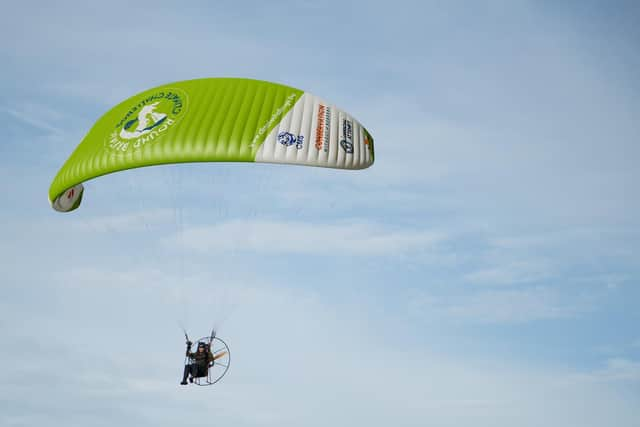 acha Dench piloting her electric paramotor. Sacha is taking on the Round Britain Climate Challenge, which is a 3,000-mile circumnavigation of mainland Britain by Sacha with an electric paramotor. The expedition is designed to inspire and excite the nation to get involved in tackling the climate crisis. Picture: CONSERVATION WITHOUT BORDERS