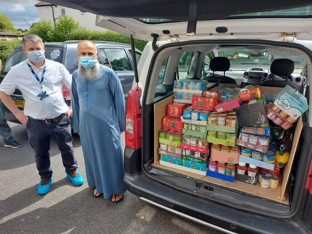 Coun Martyn Rawlinson and Siad Ugradar load up donations from the Boulevard community.