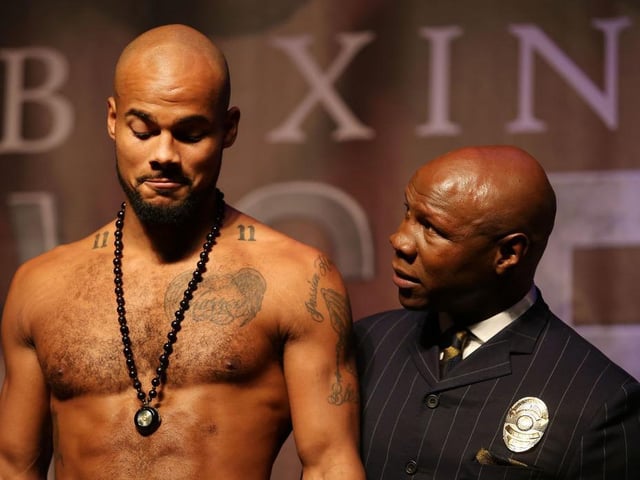Sebastian Eubank looks on as he weighs in with Chris Eubank next to him during the weigh-in ahead of the IBO World Super Middleweight Title fight between DeGale v Chris Eubank Jr. on February 22, 2019 in London