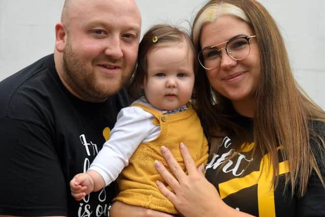 Parents Joanne and Sam and little baby daughter Olivia, who has Spina Bifida