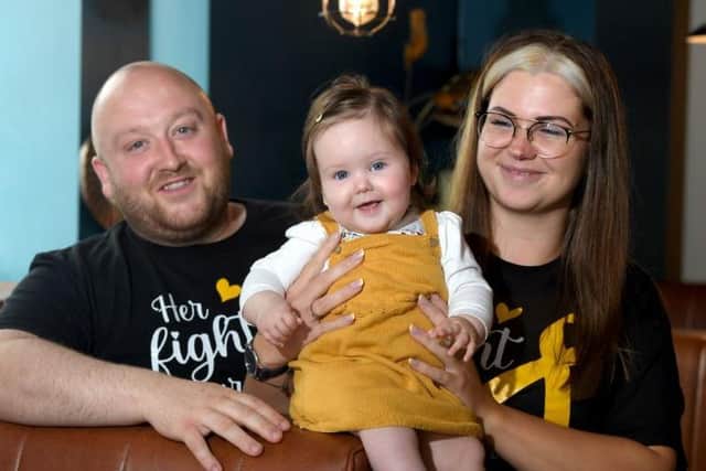 The couple, who own Fat Sam's Bar and Grill, are raising awareness and staying positive about the condition