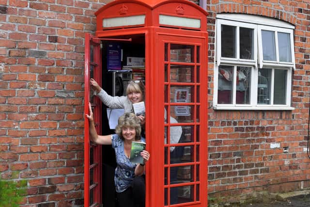 Eric Dewhurst's nieces - sisters Carole Wilson and Elaine Drelincourt - hope he would be secretly "chuffed" that Bretherton was honouring him by keeping the phone box in his memory (image: Neil Cross)