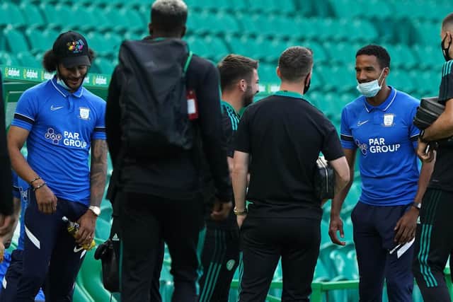PNE players Scott Sinclair Izzy Brown greet some of the Celtic players before the game
