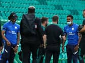 PNE players Scott Sinclair Izzy Brown greet some of the Celtic players before the game