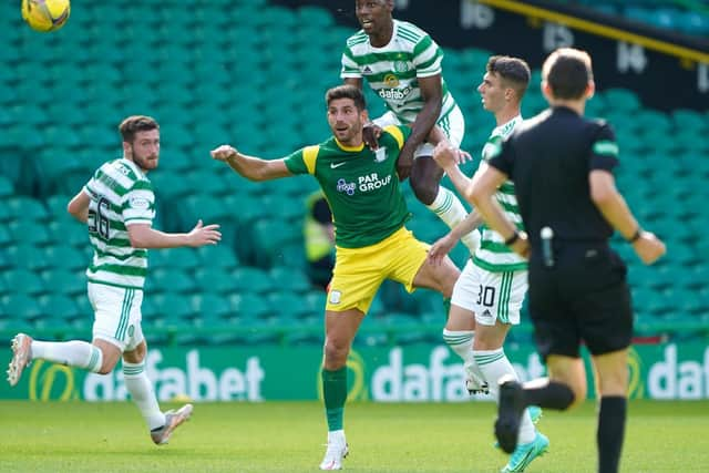 Celtic's Osaze Urhoghide gets above PNE striker Ched Evans