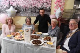 From left:  Susan Forshaw, Marjorie Hayward (Friends for You), Gianni Tsalakos (Majestic Coffee Lounge) Cath Hoyle and Chorley mayor Steve Holgate at the launch of "Talking Tables" (image: Neil Cross)