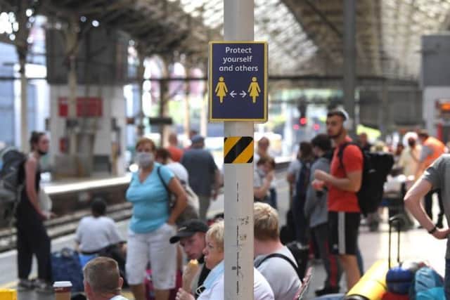 Most people catching trains at Preston Railway Station appeared to be holding or wearing a facemask ready for their journeys