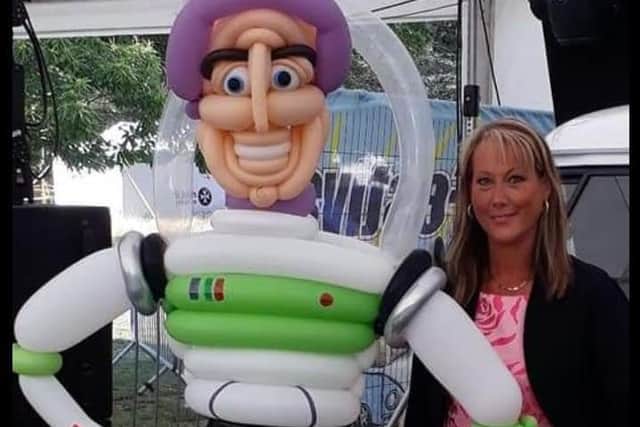 Joanne with  the  Toy Story  Buzz Lightyear character she made from balloons