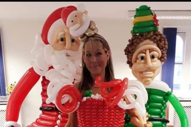 Joanne pictured with father Christmas and Elf models