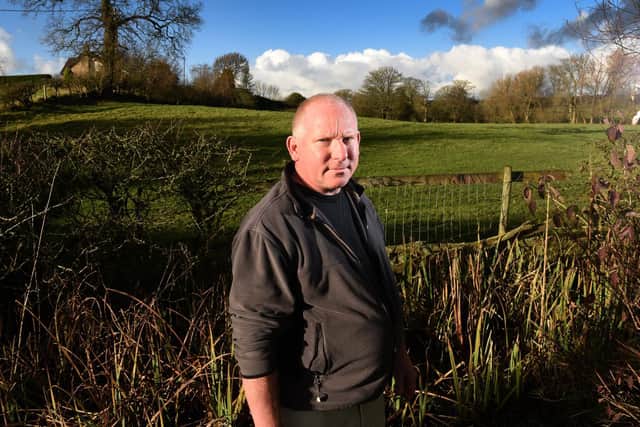 Protestor Mark Handscomb pictured by the field where a snail farm and holiday chalets could be sited.