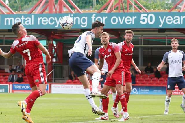 PNE defender Andrew Hughes goes up with Accrington's John O'Sullivan