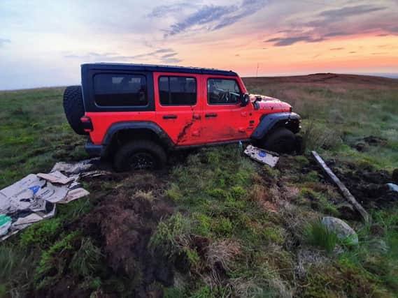 Bolton Mountain Rescue and Lancashire Police were called to Rivington Moor near Chorley at 7.45pm on Saturday (July 24) after two 4x4s - a grey Ford Ranger and a red Jeep Wrangler - got stuck on the protected peatland. Pic: Bolton Mountain Rescue