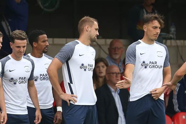 Preston North End defender Patrick Bauer (second right) waits to come on as a substitute against Accrington Stanley