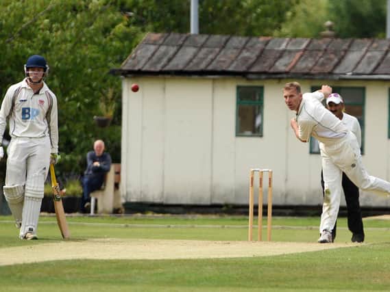 Iain Critchley sends a delivery down for Leyland