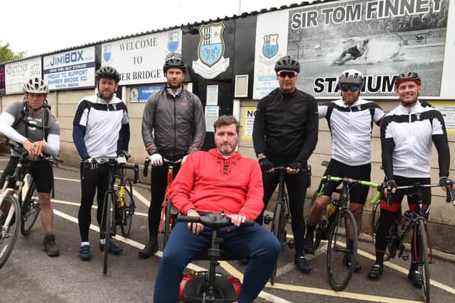 George Melling pictured outside Bamber Bridge's ground with friends who did a charity bike ride to raise funds for research into Motor Neurone Disease