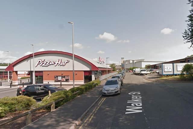 The victim was stabbed after he was approached by three men in Walker Street, Blackburn (Credit: Google)