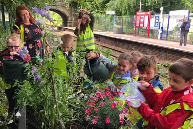 St John's RC Primary School from Burscough planting fresh plants and installing bug hotels and colourful artwork at Burscough Junction Station