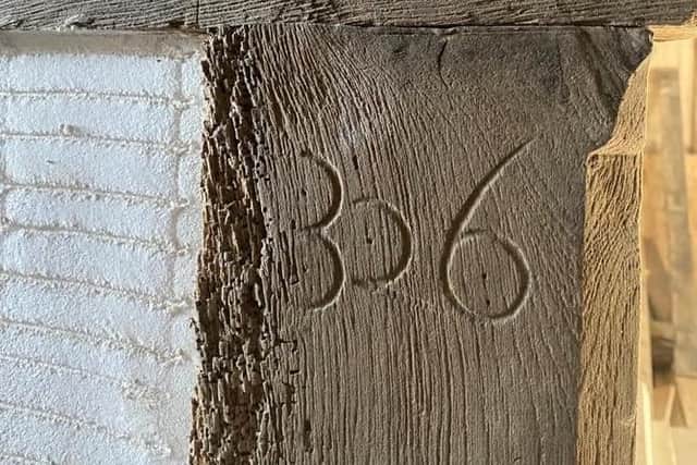 One of the numbered timber panels at Buckshaw Hall (image: Chris Langson)