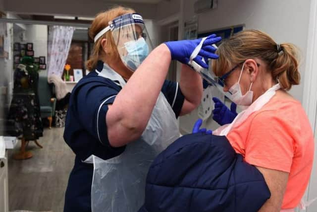 Guests at care homes must still take a lateral flow test and wear PPE