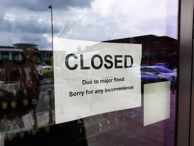 Multiple businesses in Market Walk were forced to close due to flooding on Tuesday, July 27.