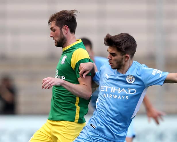 Preston’s Tom Barkhuizen challenges Manchester City midfielder Iker Pozo (photo: Getty Images)