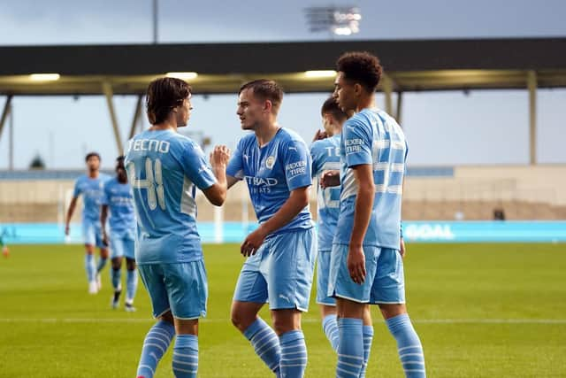 Sam Odozie celebrates scoring Manchester City's second goal against PNE