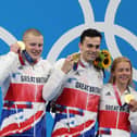 Gold medalists (left to right) Adam Peaty, James Guy, Anna Hopkin and Kathleen Dawson of Team Great Britain pose during the medal ceremony for the Mixed 4 x 100m Medley Relay Final