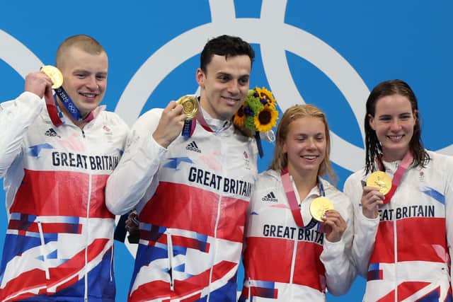 Gold medalists (left to right) Adam Peaty, James Guy, Anna Hopkin and Kathleen Dawson of Team Great Britain pose during the medal ceremony for the Mixed 4 x 100m Medley Relay Final