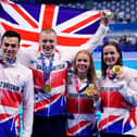 GB's winning medley team: (l-r) James Guy, Adam Peaty, Anna Hopkin and Kathleen Dawson celebrate with their gold medals.