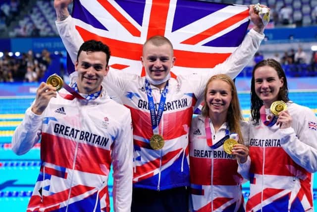 GB's winning medley team: (l-r) James Guy, Adam Peaty, Anna Hopkin and Kathleen Dawson celebrate with their gold medals.