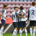 Preston North End celebrate their goal against Wigan Athletic at the DW Stadium