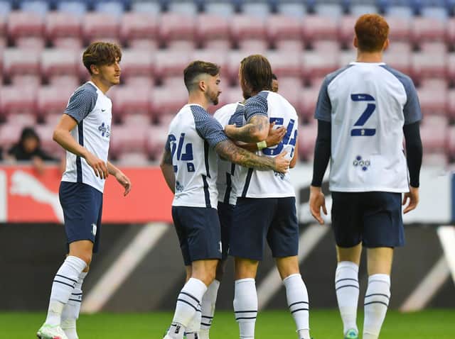 Preston North End celebrate their goal against Wigan Athletic at the DW Stadium
